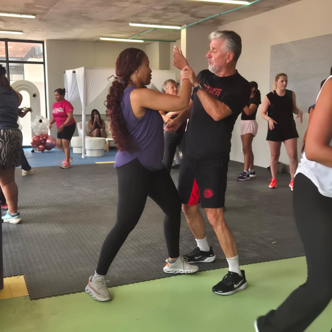 One-on-one self-defence technique practice