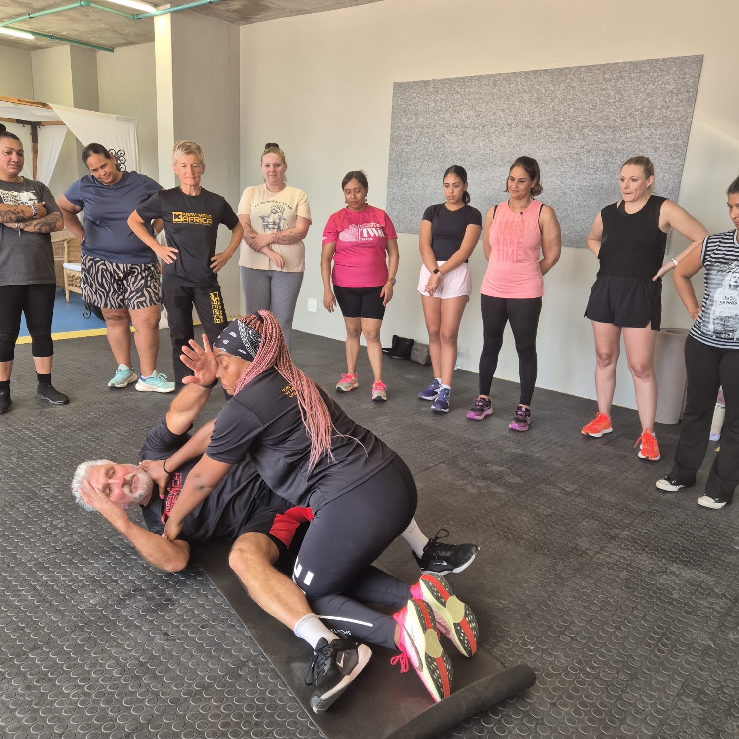 Instructor demonstrating a ground self-defence move